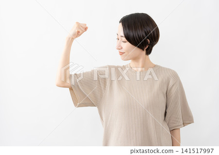 A woman in a short-sleeved knit top - Lifestyle image 141517997