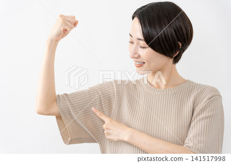 A woman in a short-sleeved knit top - Lifestyle image 141517998