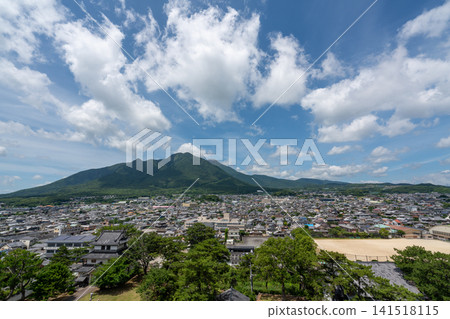 A breathtaking panoramic view of rising white clouds, Mount Mayuyama, and the city of Shimabara in Nagasaki. A breathtaking panoramic view of rising white clouds, Mount Mayuyama, and the city of Shimabara in Nagasaki. 141518115