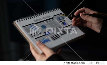 Business Professional Analyzing Data Visualizations and Graphs in a Notebook for Effective Strategy Development and Decision Making Ledger Business Professional Analyzing Data Visualizations and Graphs in a Notebook for Effective Strategy Development and Decision Making Ledger 141519110