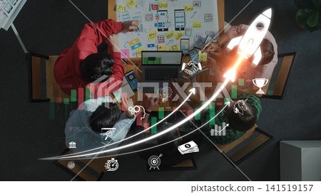 A diverse team engages in a collaborative planning session surrounded by charts, graphs, and notes, symbolizing innovation and growth in a modern workspace. Sigmoid 141519157