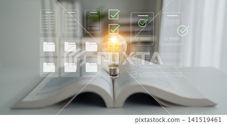 A Conceptual Representation of Innovative Ideas and Document Organization with Light Bulb Over an Open Book on a Table Cyphers. A Conceptual Representation of Innovative Ideas and Document Organization with Light Bulb Over an Open Book on a Table Cyphers. 141519461