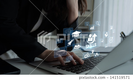 Woman Working on Laptop with Virtual Skill Icons and Educational Graphics Representing Online Learning and Professional Development Quark Woman Working on Laptop with Virtual Skill Icons and Educational Graphics Representing Online Learning and Professional Development Quark 141519571