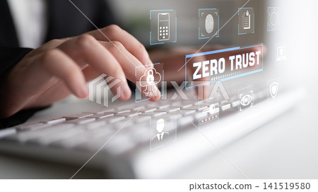 Close-Up of Hands Typing on a Keyboard with Digital Security Concept and Zero Trust Graphics in a Modern Office Environment Fluxor Close-Up of Hands Typing on a Keyboard with Digital Security Concept and Zero Trust Graphics in a Modern Office Environment Fluxor 141519580