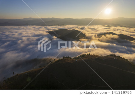 Landscape of Morning Mist with Mountain Layer. mountain ridge and clouds in rural jungle bush forest Landscape of Morning Mist with Mountain Layer. mountain ridge and clouds in rural jungle bush forest 141519795
