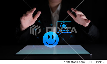Business Concept of Digital Feedback and Customer Satisfaction with Smiley Face Icon in Dark Environment for Innovative Online Reviews Cyphers. Business Concept of Digital Feedback and Customer Satisfaction with Smiley Face Icon in Dark Environment for Innovative Online Reviews Cyphers. 141519942