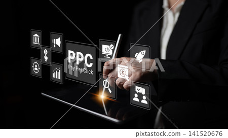 Professional Hands Using Tablet for Digital Marketing with Pay Per Click Strategy and Icons for Advertising Campaigns in a Dark Environment Ledger Professional Hands Using Tablet for Digital Marketing with Pay Per Click Strategy and Icons for Advertising Campaigns in a Dark Environment Ledger 141520676