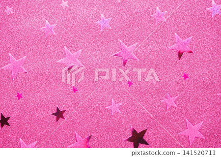 背景圖片為一張帶有星形圖案的金屬色紙張的特寫。 141520711