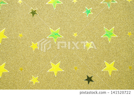 背景圖片為一張帶有星形圖案的金屬色紙張的特寫。 141520722