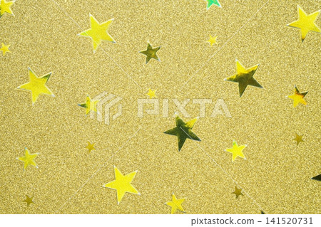 A background image featuring a close-up of metallic colored paper with a star pattern. A background image featuring a close-up of metallic colored paper with a star pattern. 141520731