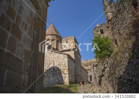 Ancient Ananuri fortress stone church tower under blue sky in Georgia with copy space Ancient Ananuri fortress stone church tower under blue sky in Georgia with copy space 141520802