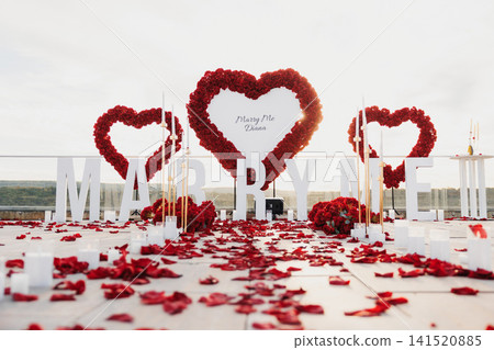Red petals blanket a proposal setup Red petals blanket a proposal setup 141520885