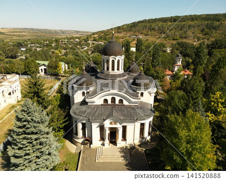 Grand church with domes rises above green hills Grand church with domes rises above green hills 141520888