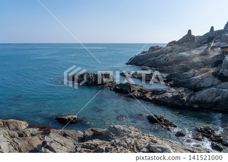 The stunning scenery of the rugged rocky cliffs and blue sea at Haedong Yonggungsa Temple The stunning scenery of the rugged rocky cliffs and blue sea at Haedong Yonggungsa Temple 141521000