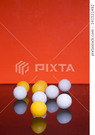 Still life with white and yellow balloons on a colored background Still life with white and yellow balloons on a colored background 141521492