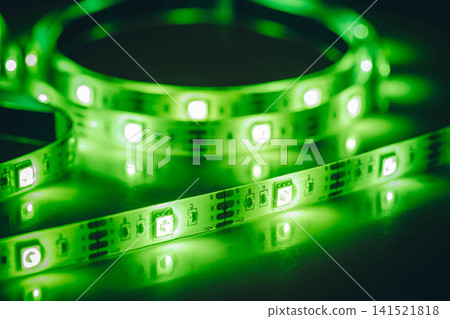 Green LED strip light close-up with glowing diodes Green LED strip light close-up with glowing diodes 141521818