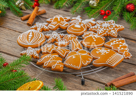 Decorated Christmas Gingerbread Cookies on Rustic Wooden Table Decorated Christmas Gingerbread Cookies on Rustic Wooden Table 141521890