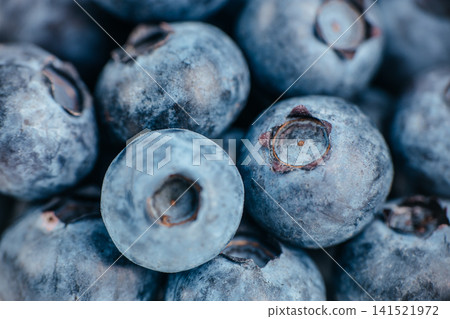 Macro Close Up of Fresh Blueberries with Natural Bloom Texture Macro Close Up of Fresh Blueberries with Natural Bloom Texture 141521972