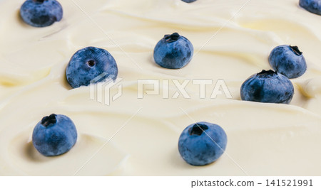 Fresh Blueberries On Creamy Yogurt Texture Background 141521991