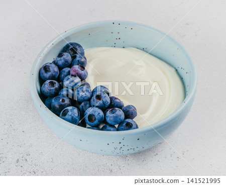 Greek Yogurt With Fresh Blueberries In Ceramic Bowl Greek Yogurt With Fresh Blueberries In Ceramic Bowl 141521995