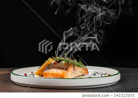 Steaming Grilled Salmon Fillet with Rosemary Lemon and Aromatic Smoke 141522055