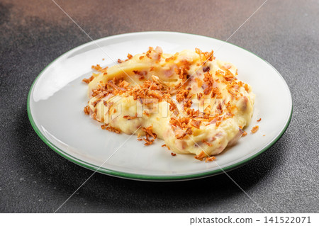 Creamy Potato Dumplings with Fried Onion on White Plate Creamy Potato Dumplings with Fried Onion on White Plate 141522071