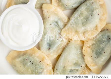 Boiled Spinach Dumplings with Sour Cream Top View 141522077