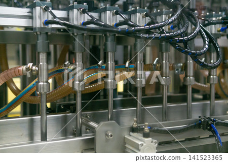 Industrial production line for the for bottling of liquides in the factory Industrial production line for the for bottling of liquides in the factory 141523365