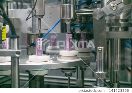 Production line at the cosmetics factory. Industrial background. Production line at the cosmetics factory. Industrial background. 141523366