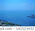 The expansive blue sea and harbor scenery viewed from the observation deck. 141523432