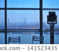 The coastal industrial area seen through the observation room window and the landscape with binoculars 141523435