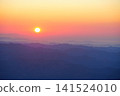 The view of the rising sun over the many mountain ranges seen from Mount Akagi. 141524010