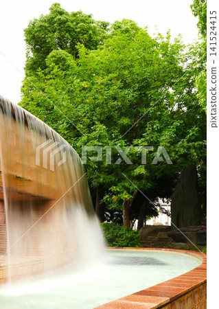A wading pool flowing through the park A wading pool flowing through the park 141524415