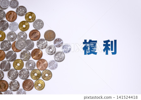 A text on compound interest and a Japanese yen coin. A text on compound interest and a Japanese yen coin. 141524418