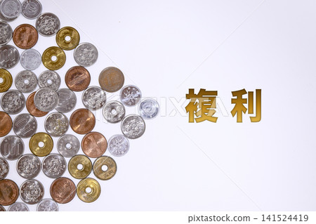 A text on compound interest and a Japanese yen coin. A text on compound interest and a Japanese yen coin. 141524419