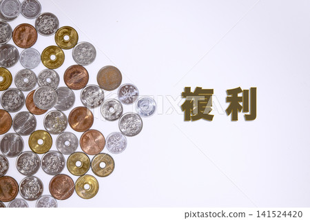 A text on compound interest and a Japanese yen coin. A text on compound interest and a Japanese yen coin. 141524420