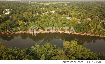Aerial View of a Long Line of Fishing Stalls by a Pond in Kushtia, Bangladesh Aerial View of a Long Line of Fishing Stalls by a Pond in Kushtia, Bangladesh 141524500