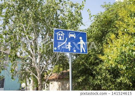 A blue sign in the street A blue sign in the street 141524615