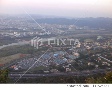 Taiwan New Taipei - 02.06.2011: Dahan River, Sanxia District, Taiwan Self-Lai Water Company Panxin Water Works (Banxin Water Works), distant place is Yingge District Taiwan New Taipei - 02.06.2011: Dahan River, Sanxia District, Taiwan Self-Lai Water Company Panxin Water Works (Banxin Water Works), distant place is Yingge District 141524665