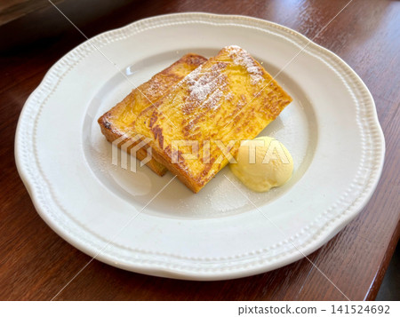 French toast served with whipped butter French toast served with whipped butter 141524692