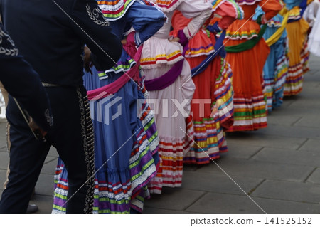 Mexican folk parade in the street Mexican folk parade in the street 141525152