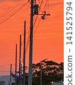 Clouds and power lines in the sunset 141525794