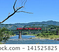 Local train running on the iron bridge 141525825