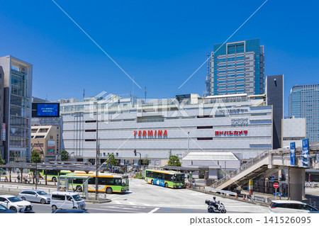 A view of the JR Kinshicho Station South Exit plaza on a clear, sunny day with a blue sky. A view of the JR Kinshicho Station South Exit plaza on a clear, sunny day with a blue sky. 141526095