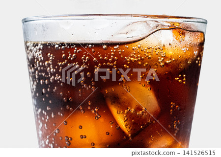 Close-up of the carbonated bubbles in a cola Close-up of the carbonated bubbles in a cola 141526515