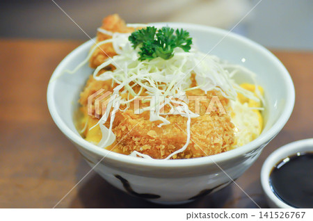 fried pork and rice, pork ball or Breaded Pork Cutlet Bowl or Butadon or Deep fried Pork Cutlet on Rice or Japanese pork cutlet or Tonkatsu 141526767