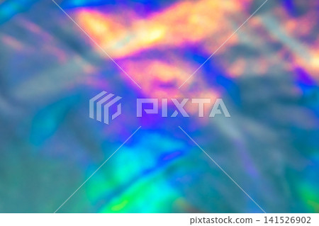 Abstract colorful iridescent holographic background with blurred rainbow light and dreamy soft texture Abstract colorful iridescent holographic background with blurred rainbow light and dreamy soft texture 141526902