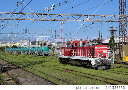 A scene from a freight station with a diesel locomotive. A scene from a freight station with a diesel locomotive. 141527333