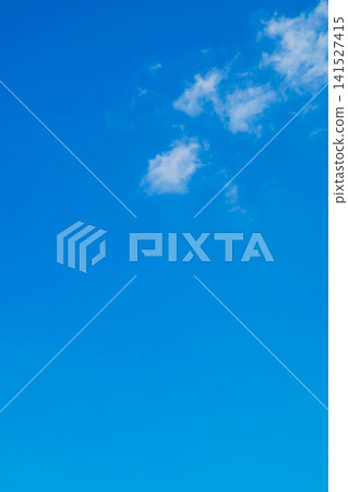 a lonely white cloud in a high pure blue sky on a clear sunny day a lonely white cloud in a high pure blue sky on a clear sunny day 141527415