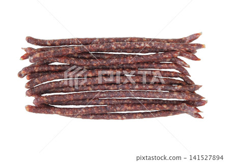 Beef semi-dry sausages. Raw cured sausages on a white background. Snack for beer. Top view. Beef semi-dry sausages. Raw cured sausages on a white background. Snack for beer. Top view. 141527894